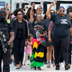 A group arrives to pay their respects at a memorial service for Jayland Walker, Wednesday, July 13, 2022, at the Akron Civic Center in Akron, Ohio. Walker, a Black motorist, was killed by Akron police in a hail of gunfire after a car and foot chase that began with an attempted traffic stop. The shooting is under investigation.